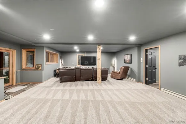 a large bedroom with bed and window