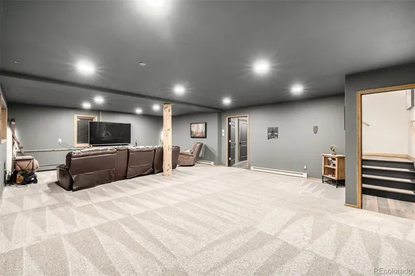 a large bedroom with a large bed and a tv