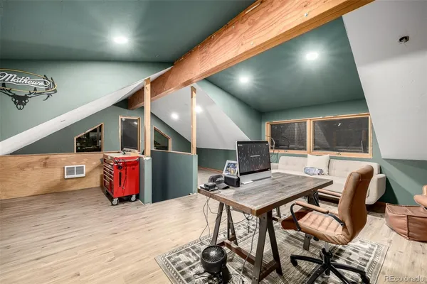 a workspace with furniture and window
