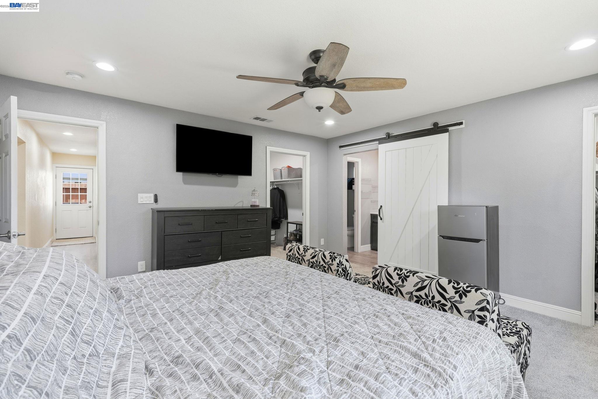 10378 South Priest Road French Camp, CA 95231 - Photo 21 of 44 a bedroom with a bed and a flat screen tv