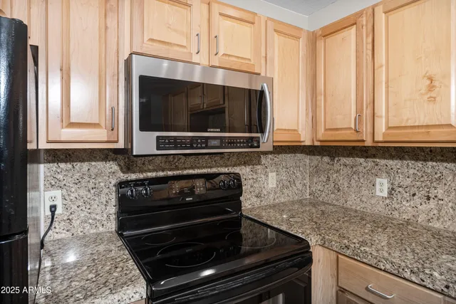 a kitchen with sink cabinets and window