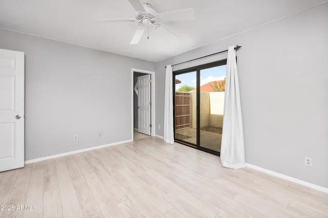 a bathroom with a sink vanity mirror and toilet