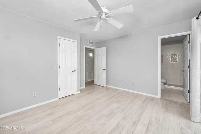a bathroom with a shower toilet and sink