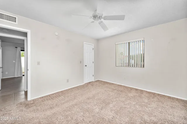 a view of backyard with green space and deck