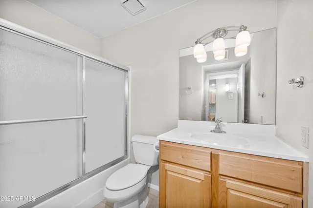 a balcony with furniture and a potted plant