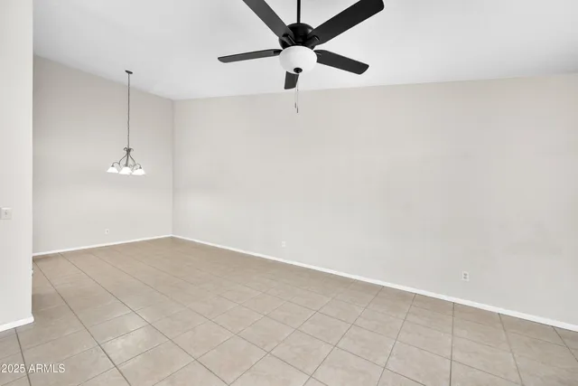 a view of a room with a ceiling fan
