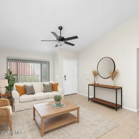a view of a kitchen with a sink and a refrigerator