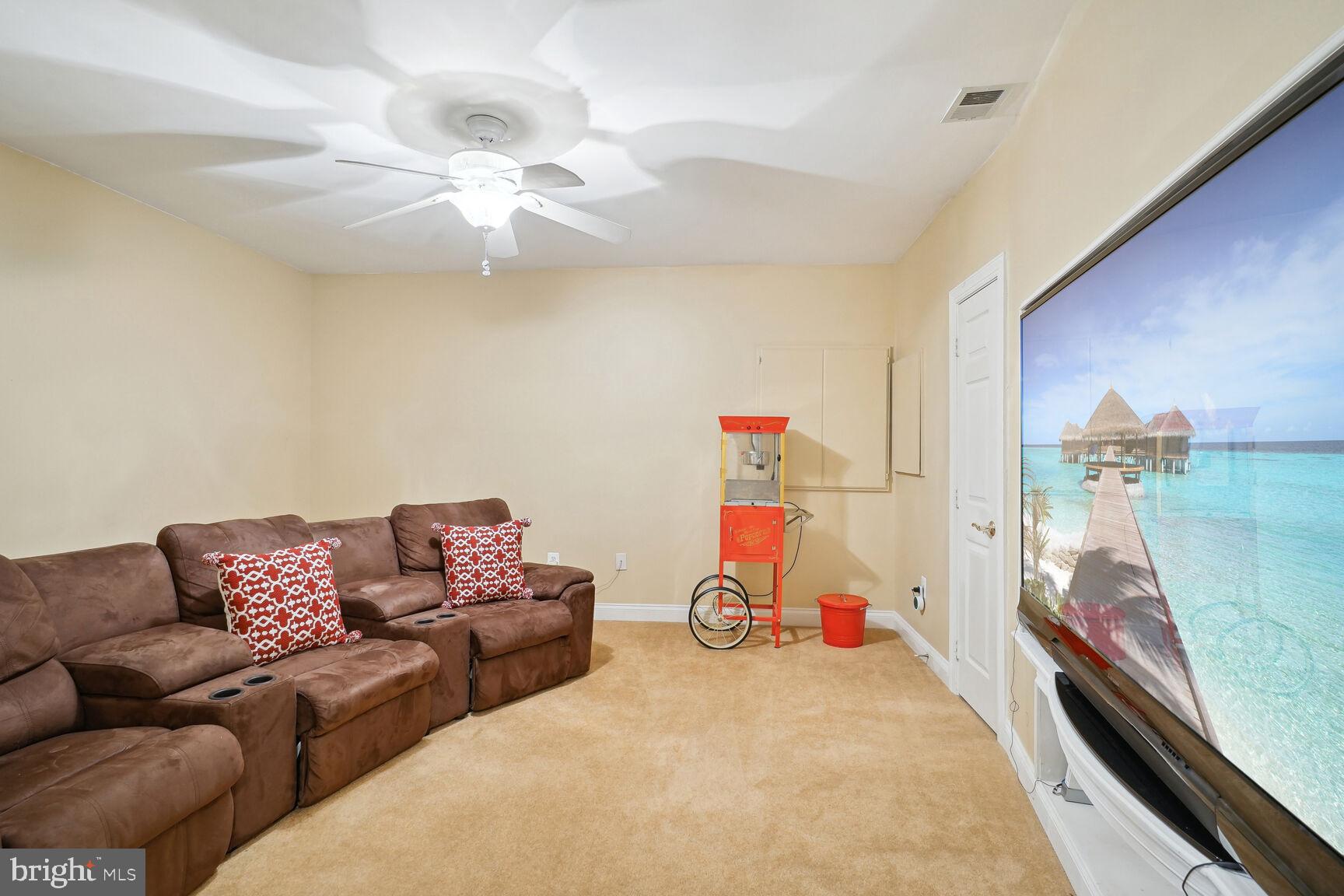 403 Firestone Drive Ashton, MD 20861 - Photo 38 of 58 Movie Theater - Seats and TV Convey