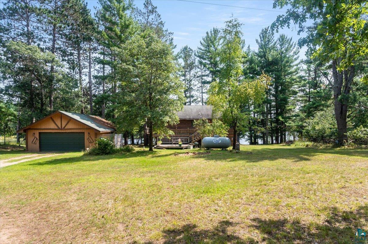 11758 South Long Lake Road Solon Springs, WI 54873 - Photo 7 of 38 View of yard featuring an outbuilding and a garage