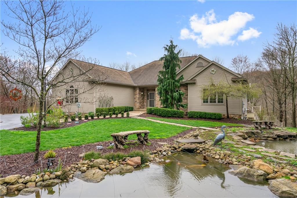 a front view of a house with garden