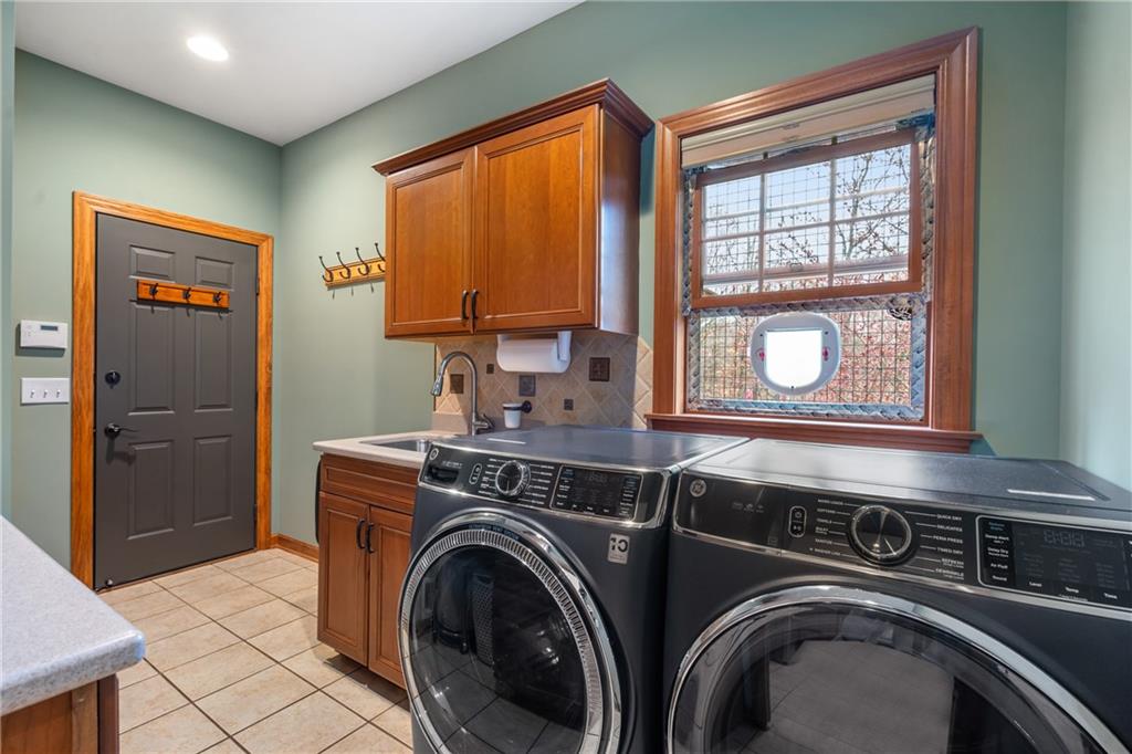 4275 Burtner Road Natrona Heights, PA 15065 - Photo 15 of 42 a utility room with dryer and washer