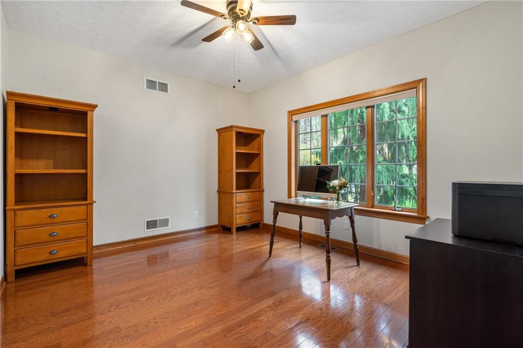 4275 Burtner Road Natrona Heights, PA 15065 - Photo 16 of 42 a living room with furniture and a window