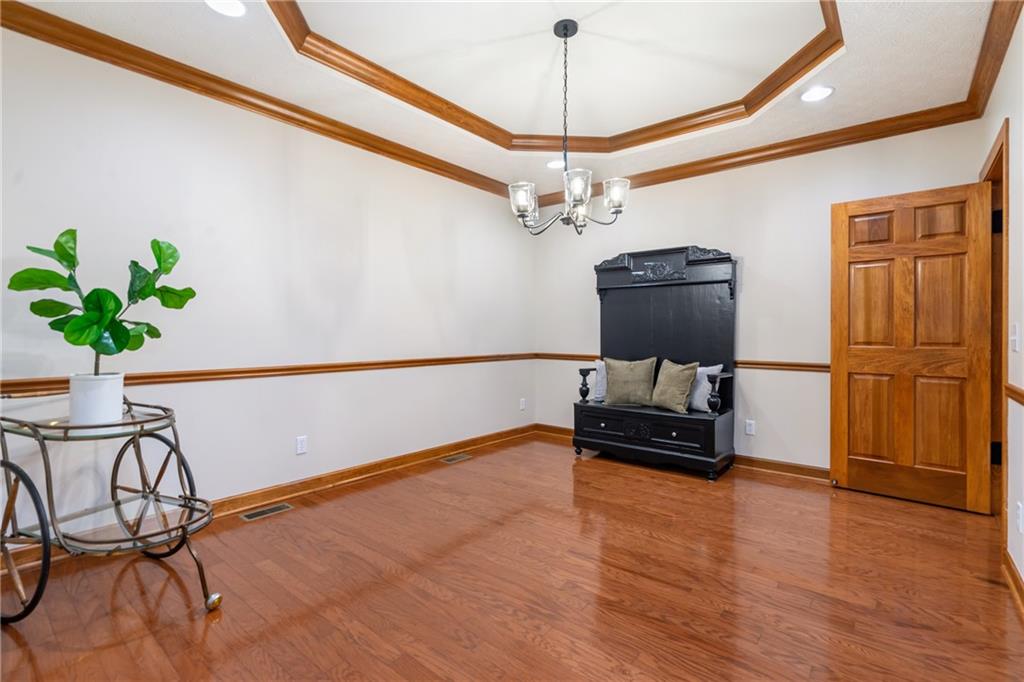4275 Burtner Road Natrona Heights, PA 15065 - Photo 18 of 42 a living room with furniture and a chandelier