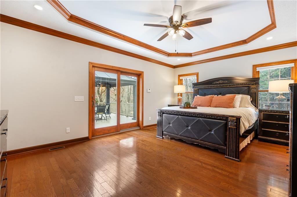 4275 Burtner Road Natrona Heights, PA 15065 - Photo 20 of 42 a bedroom with a bed ceiling fan and a window
