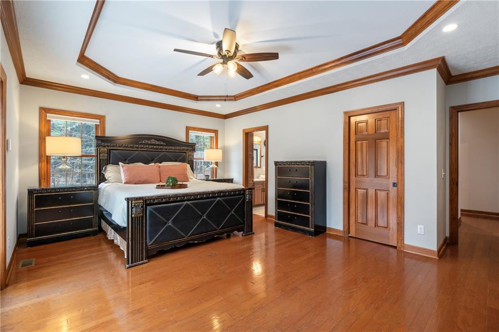 4275 Burtner Road Natrona Heights, PA 15065 - Photo 21 of 42 a bedroom with bed and wooden floors