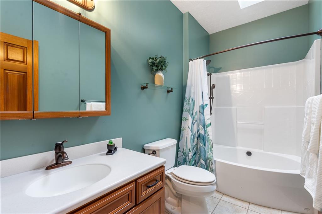 4275 Burtner Road Natrona Heights, PA 15065 - Photo 27 of 42 a bathroom with a sink toilet and shower