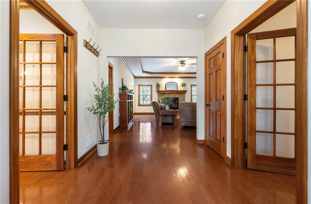 4275 Burtner Road Natrona Heights, PA 15065 - Photo 4 of 42 a view of a livingroom with furniture hardwood floor and a large window