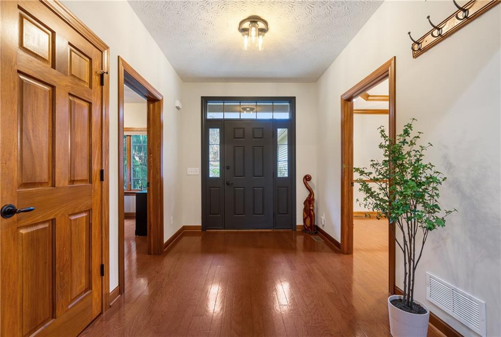 4275 Burtner Road Natrona Heights, PA 15065 - Photo 5 of 42 a view of entryway with wooden floor and front door