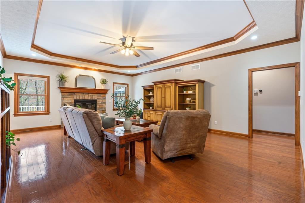 4275 Burtner Road Natrona Heights, PA 15065 - Photo 6 of 42 a living room with furniture a fireplace and a ceiling fan