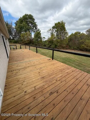 a view of a pathway with a yard