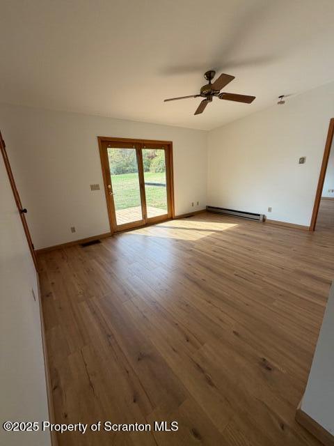 2743 River Road Wysox, PA 18854 - Photo 8 of 32 an empty room with wooden floor fan and windows