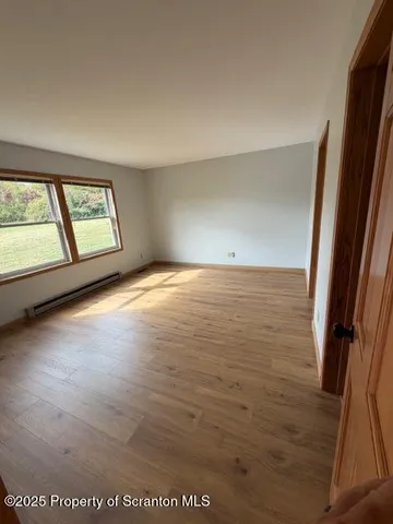 a view of an empty room with a window