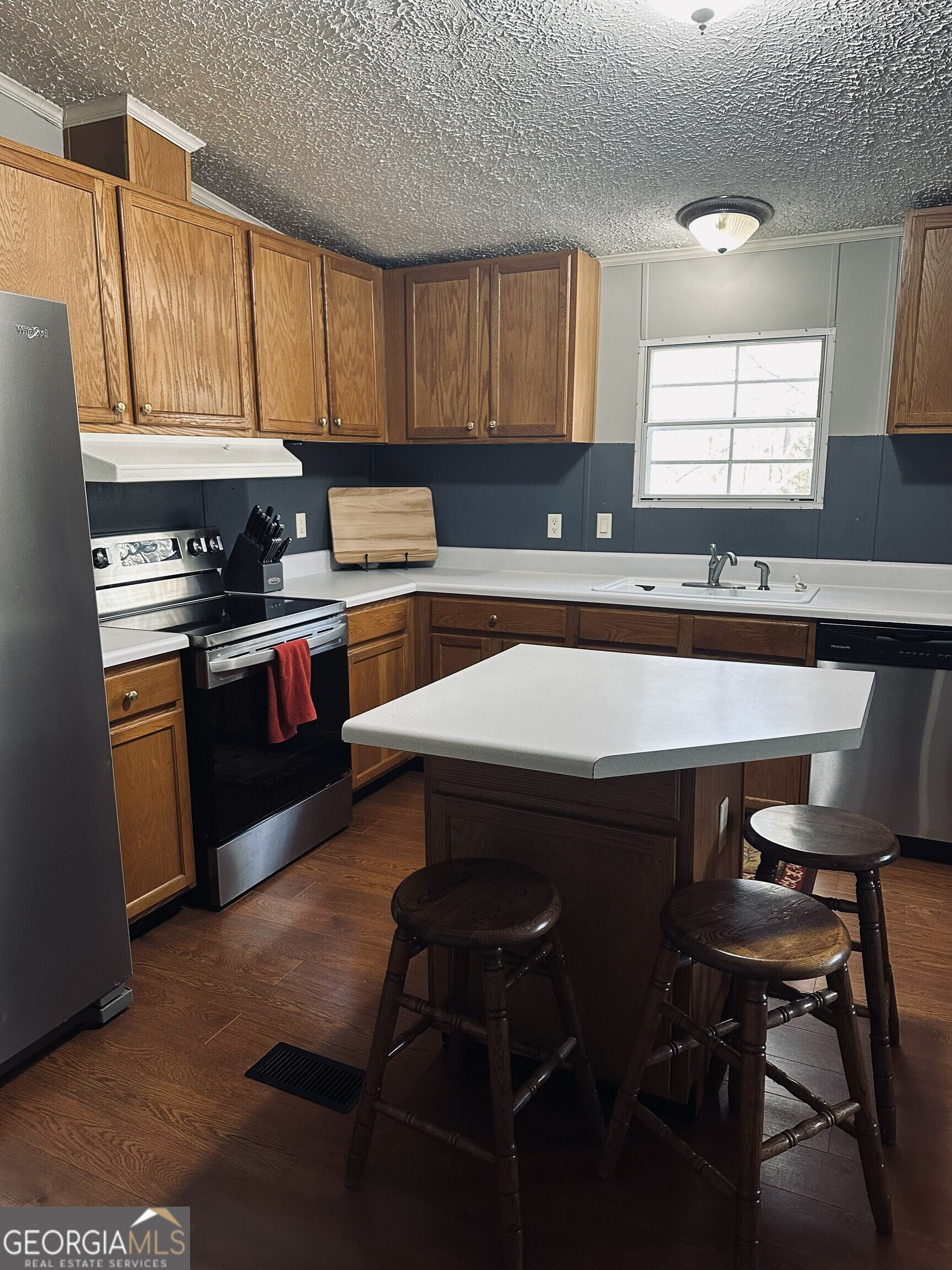 6675 Millwood Road, Unit 1B Gainesville, GA 30506 - Photo 5 of 10 a kitchen with a sink cabinets and window