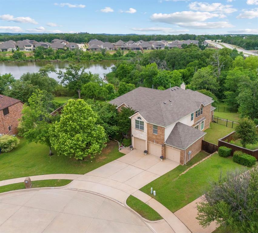 2703 Pottery Trail Corinth, TX 76210 - Photo 1 of 40 an aerial view of a house with yard and lake view