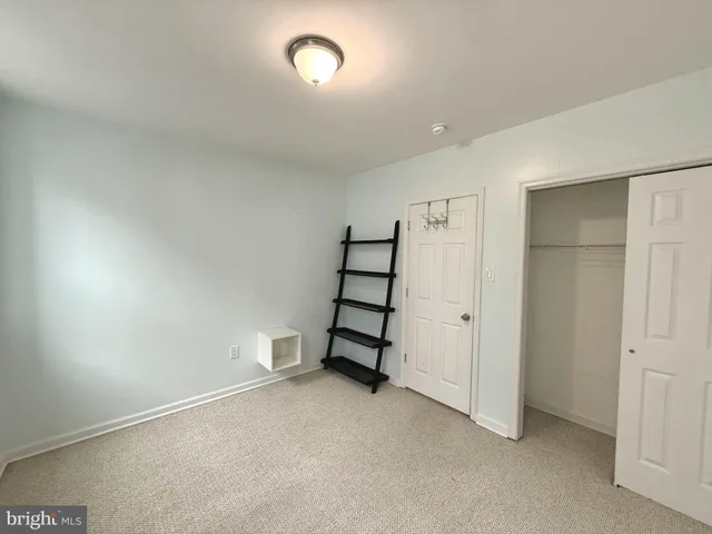 an empty room with a staircase