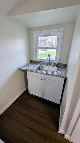 a kitchen with a sink and a window