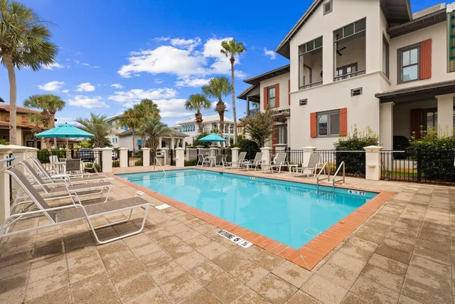 a view of a swimming pool with a lounge chairs