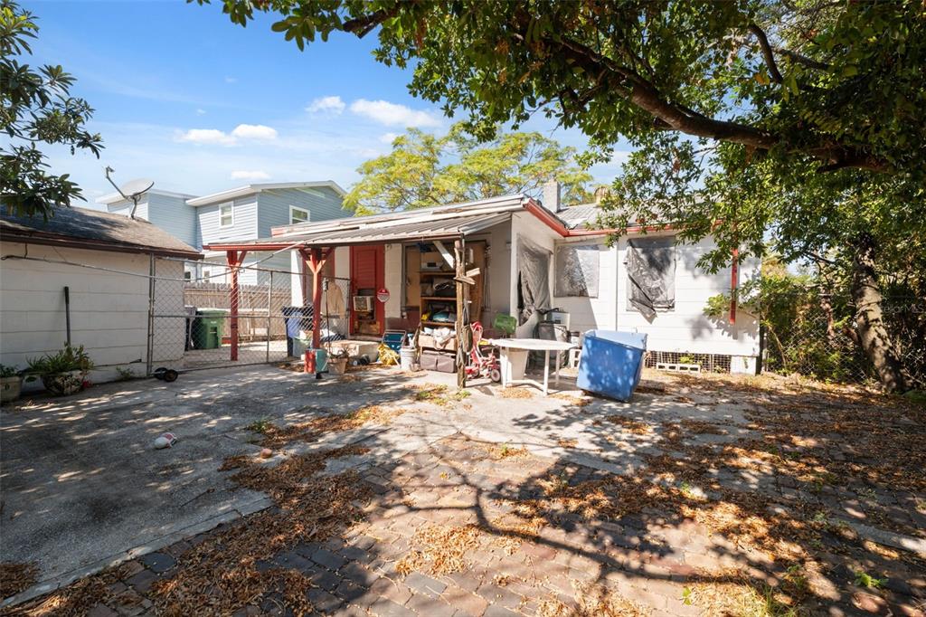 1916 West Grace Street Tampa, FL 33607 - Photo 7 of 26 a view of a house with backyard porch and sitting area