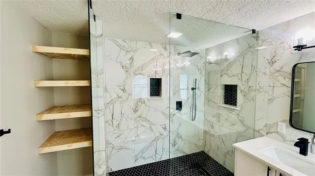 a bathroom with a double vanity sink toilet and mirror