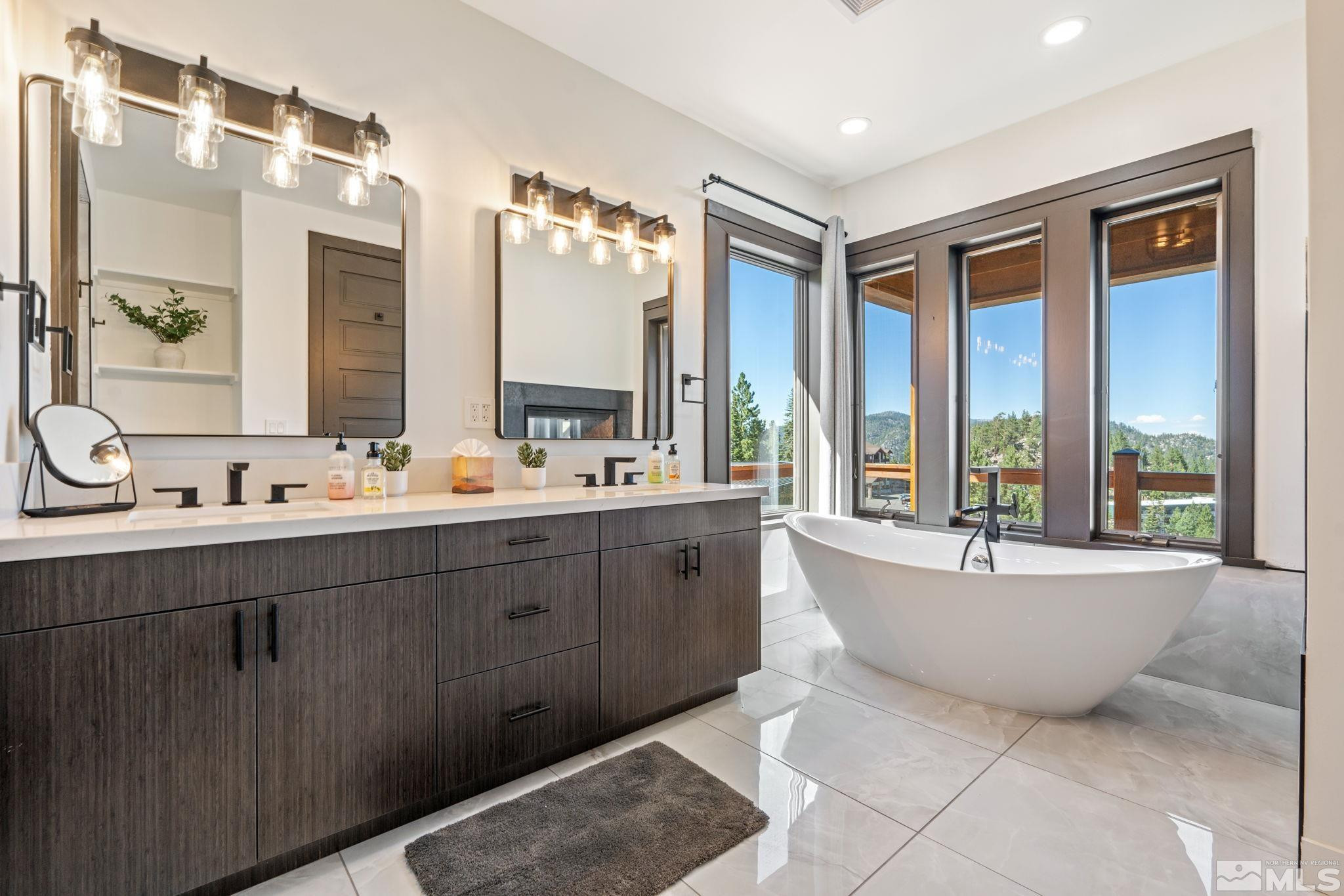 1625 Black Bear Run Stateline, NV 89449 - Photo 11 of 20 a bathroom with a large tub sink and mirror