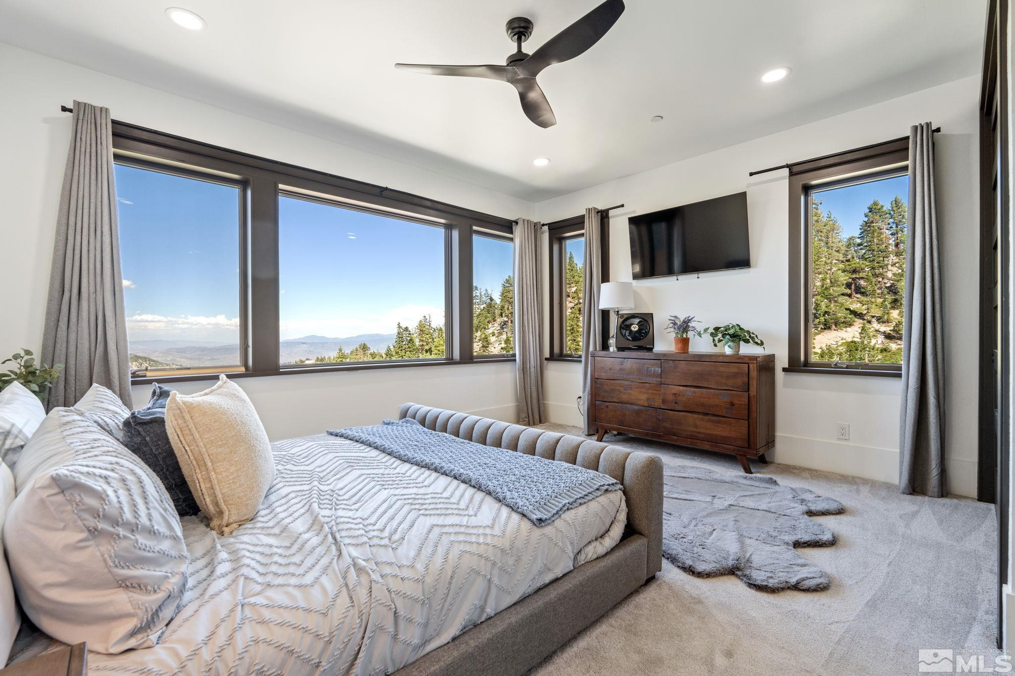 1625 Black Bear Run Stateline, NV 89449 - Photo 12 of 20 a bedroom with a large bed and a window