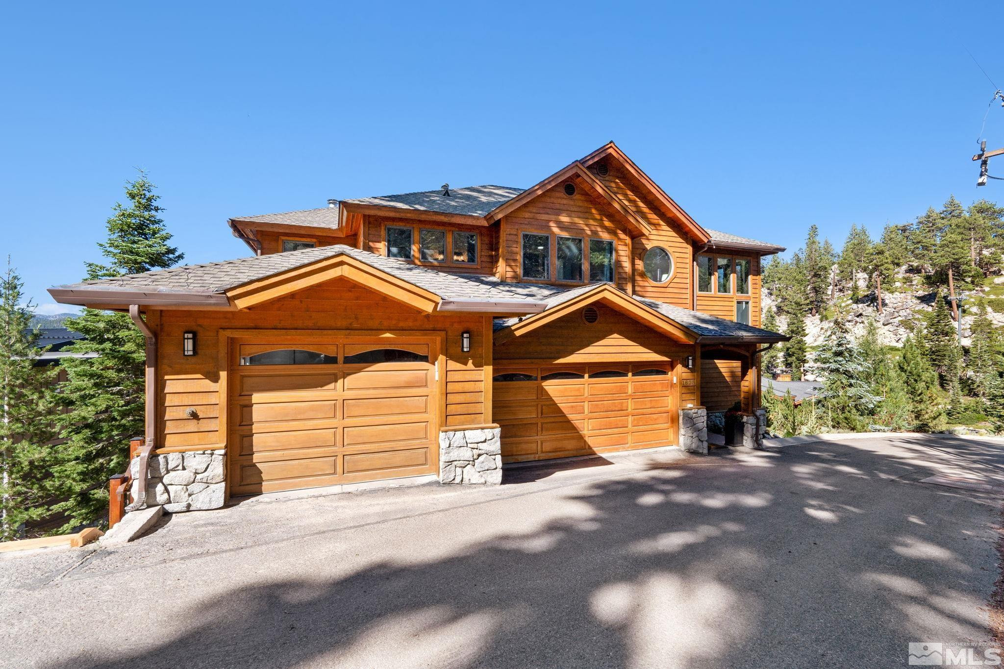 1625 Black Bear Run Stateline, NV 89449 - Photo 20 of 20 a front view of a house with a yard and garage