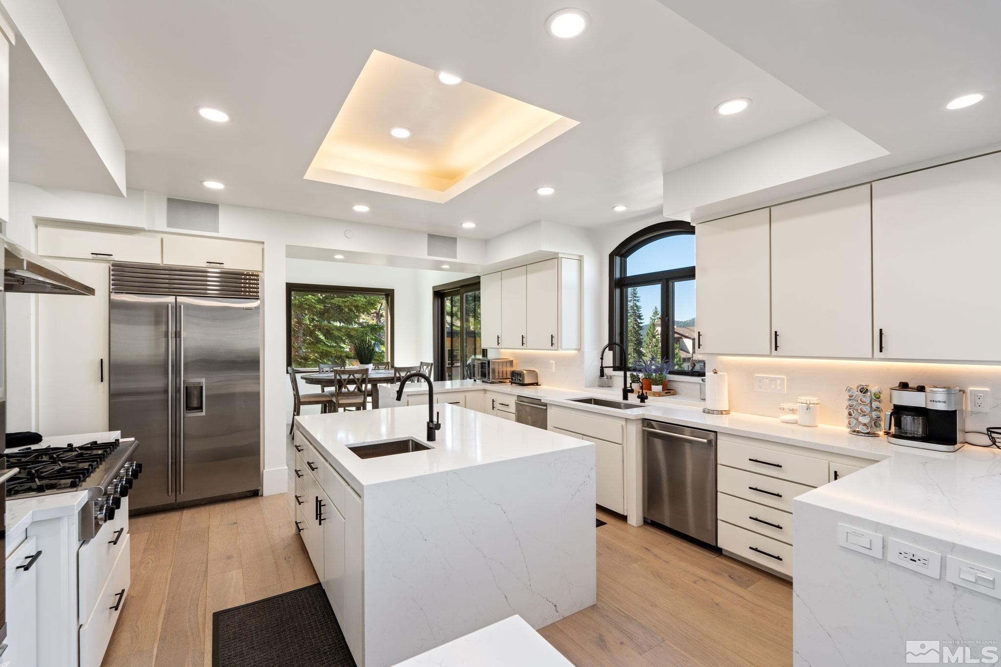 1625 Black Bear Run Stateline, NV 89449 - Photo 7 of 20 a kitchen with counter top space cabinets stainless steel appliances and a window