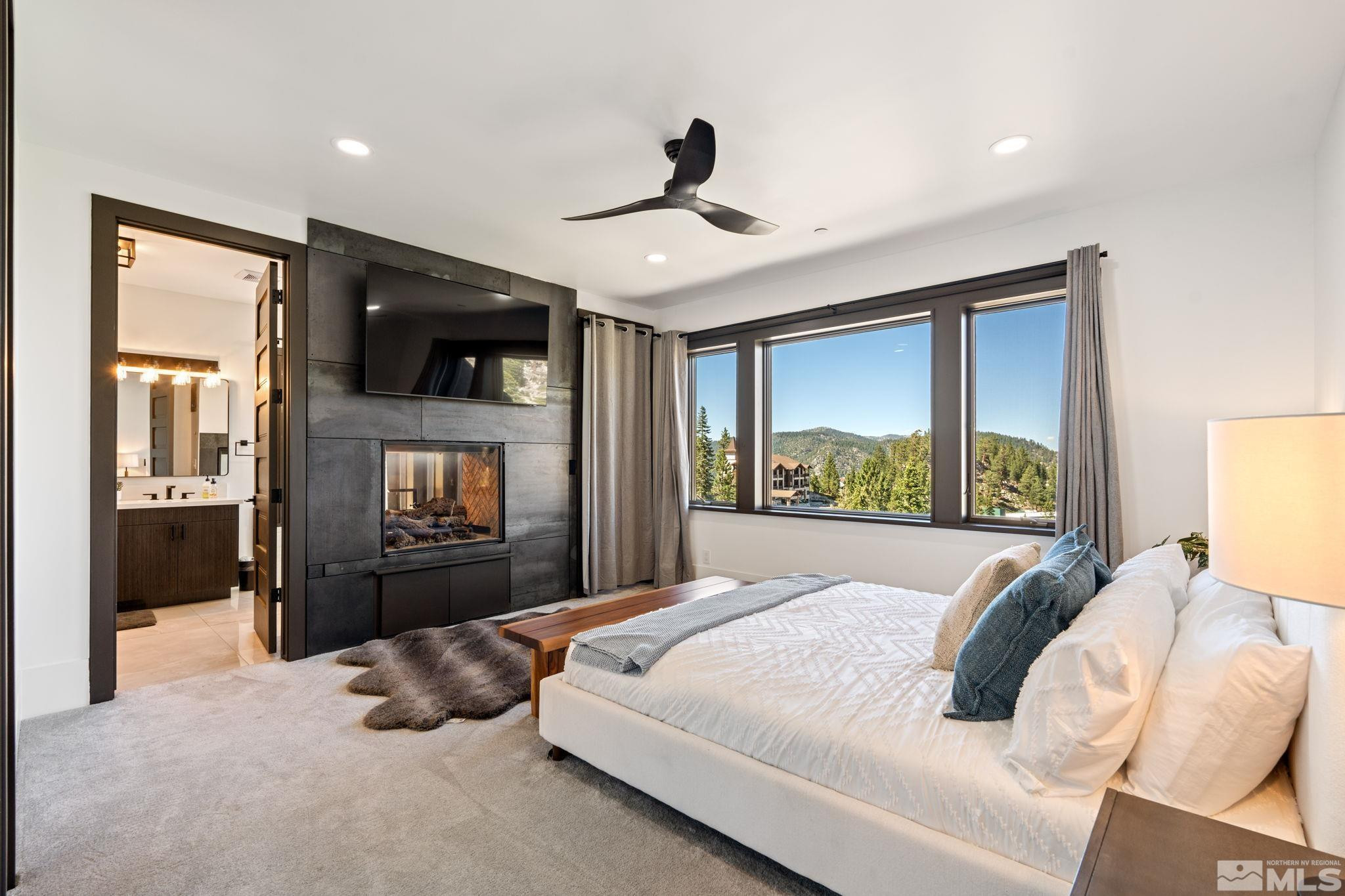 1625 Black Bear Run Stateline, NV 89449 - Photo 10 of 20 a bedroom with a large bed and a large window