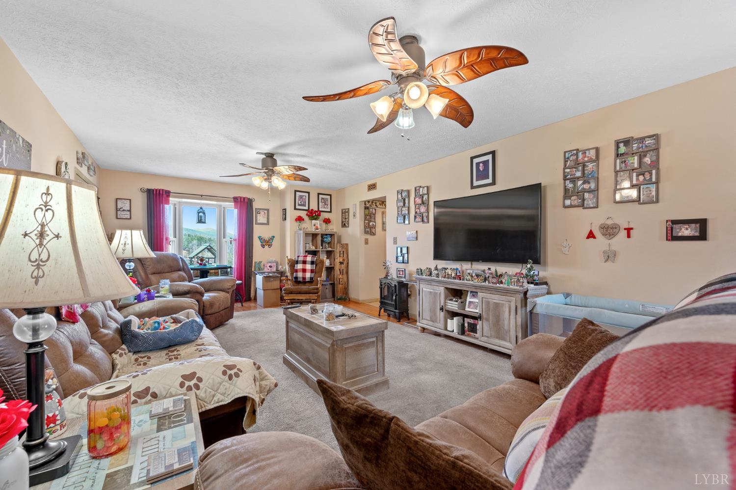 1925 Forbes Mill Road Bedford, VA 24523 - Photo 11 of 58 a living room with furniture and a flat screen tv