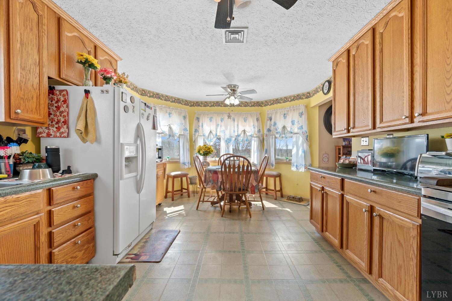 1925 Forbes Mill Road Bedford, VA 24523 - Photo 18 of 58 a open kitchen with stainless steel appliances granite countertop a refrigerator and a sink