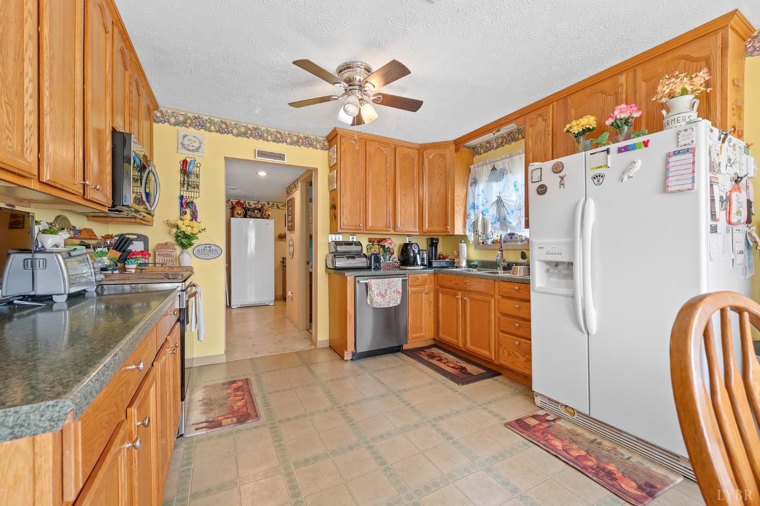1925 Forbes Mill Road Bedford, VA 24523 - Photo 22 of 58 a kitchen with a refrigerator a sink and dishwasher