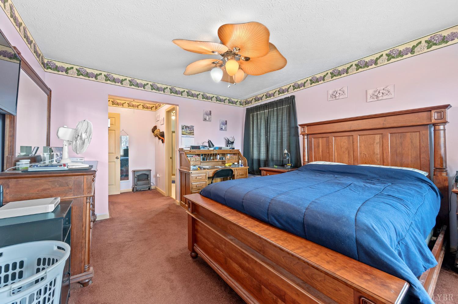 1925 Forbes Mill Road Bedford, VA 24523 - Photo 26 of 58 a bed room with a bed mirror and a chandelier