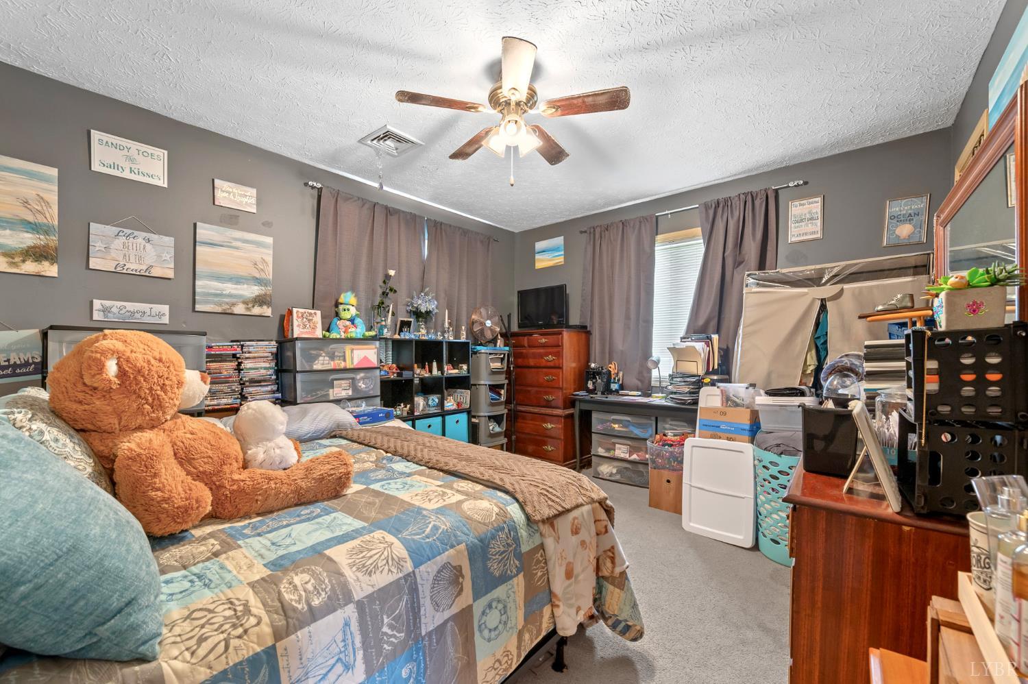 1925 Forbes Mill Road Bedford, VA 24523 - Photo 32 of 58 a bedroom with furniture a large bed and a chandelier