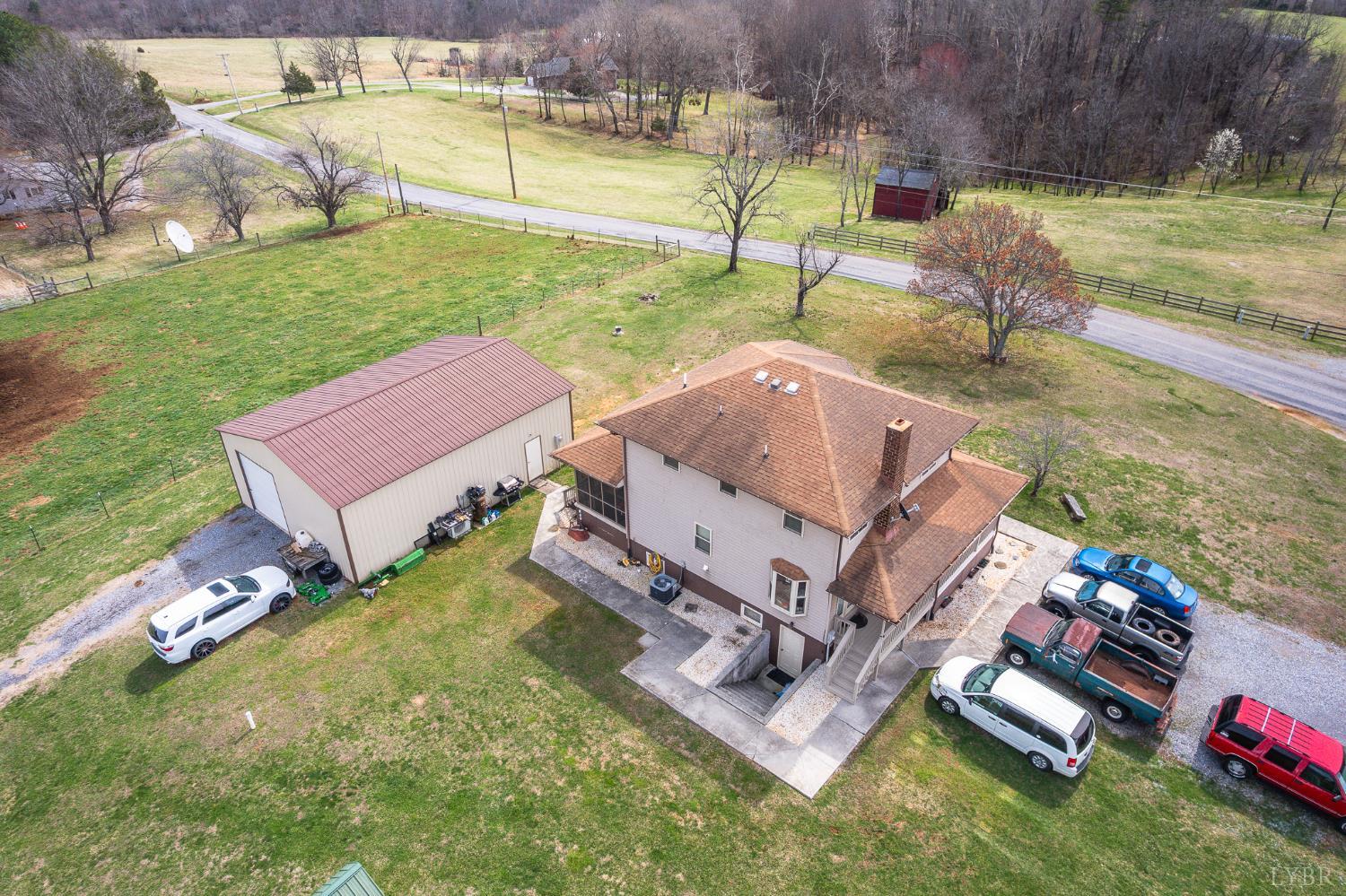 1925 Forbes Mill Road Bedford, VA 24523 - Photo 52 of 58 an aerial view of a house with backyard space and swimming pool
