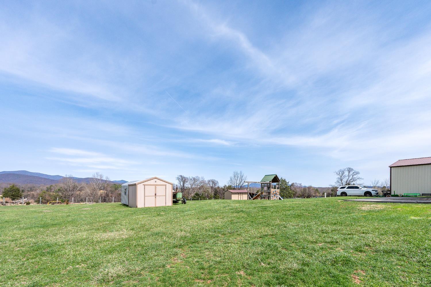 1925 Forbes Mill Road Bedford, VA 24523 - Photo 54 of 58 a view of a big yard with a house in the background
