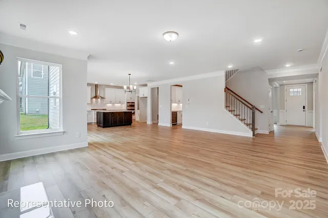 a view of livingroom with hardwood floor and a ceiling fan