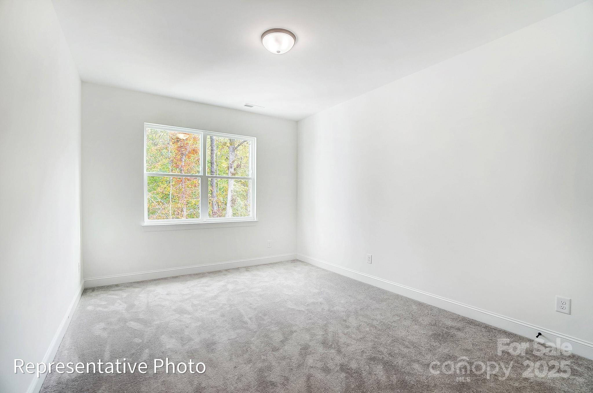 2241 Tabor Road Sherrills Ford, NC 28673 - Photo 18 of 38 an empty room with windows