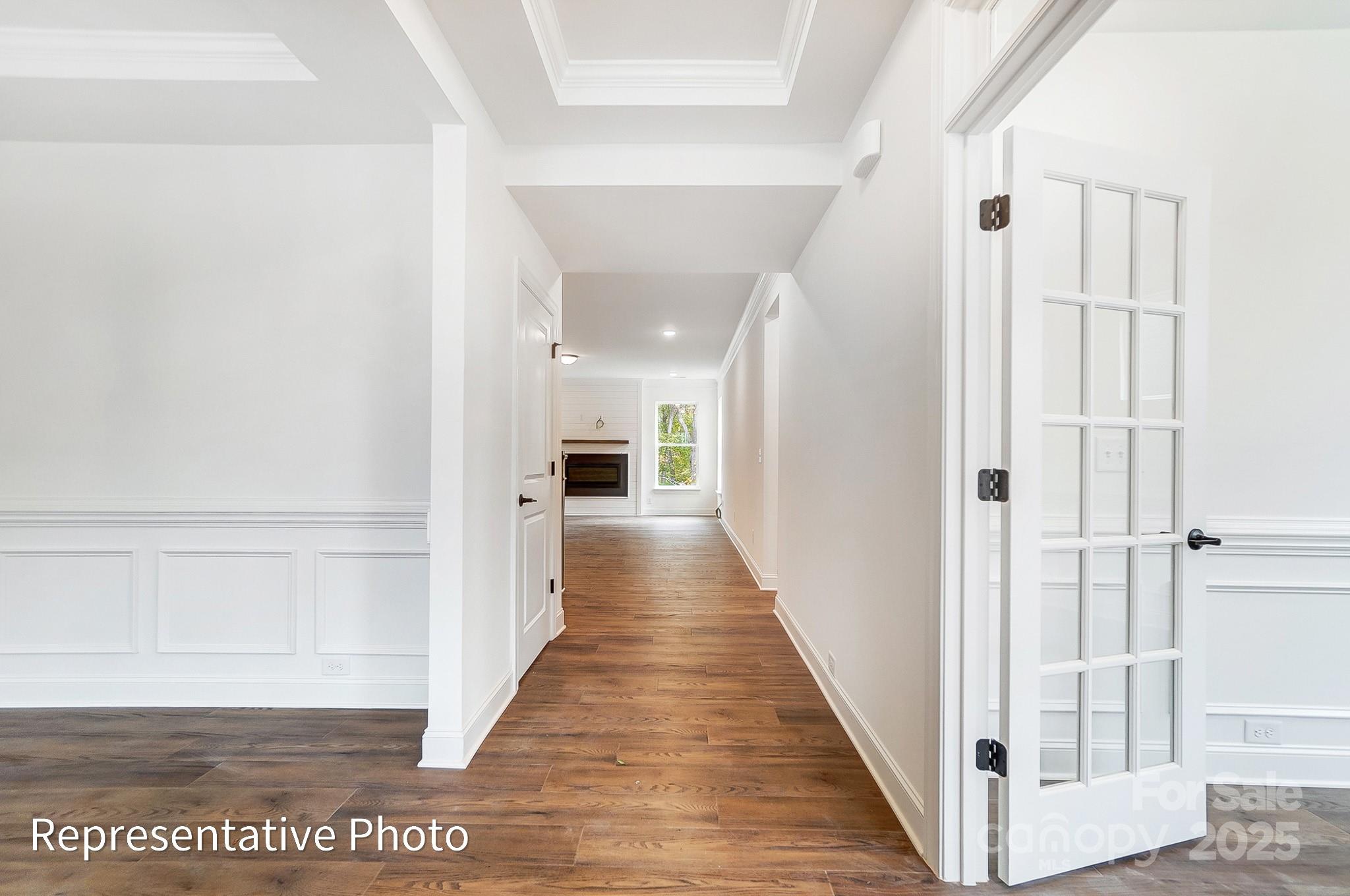 2241 Tabor Road Sherrills Ford, NC 28673 - Photo 2 of 38 a view of a hallway with wooden floor and staircase