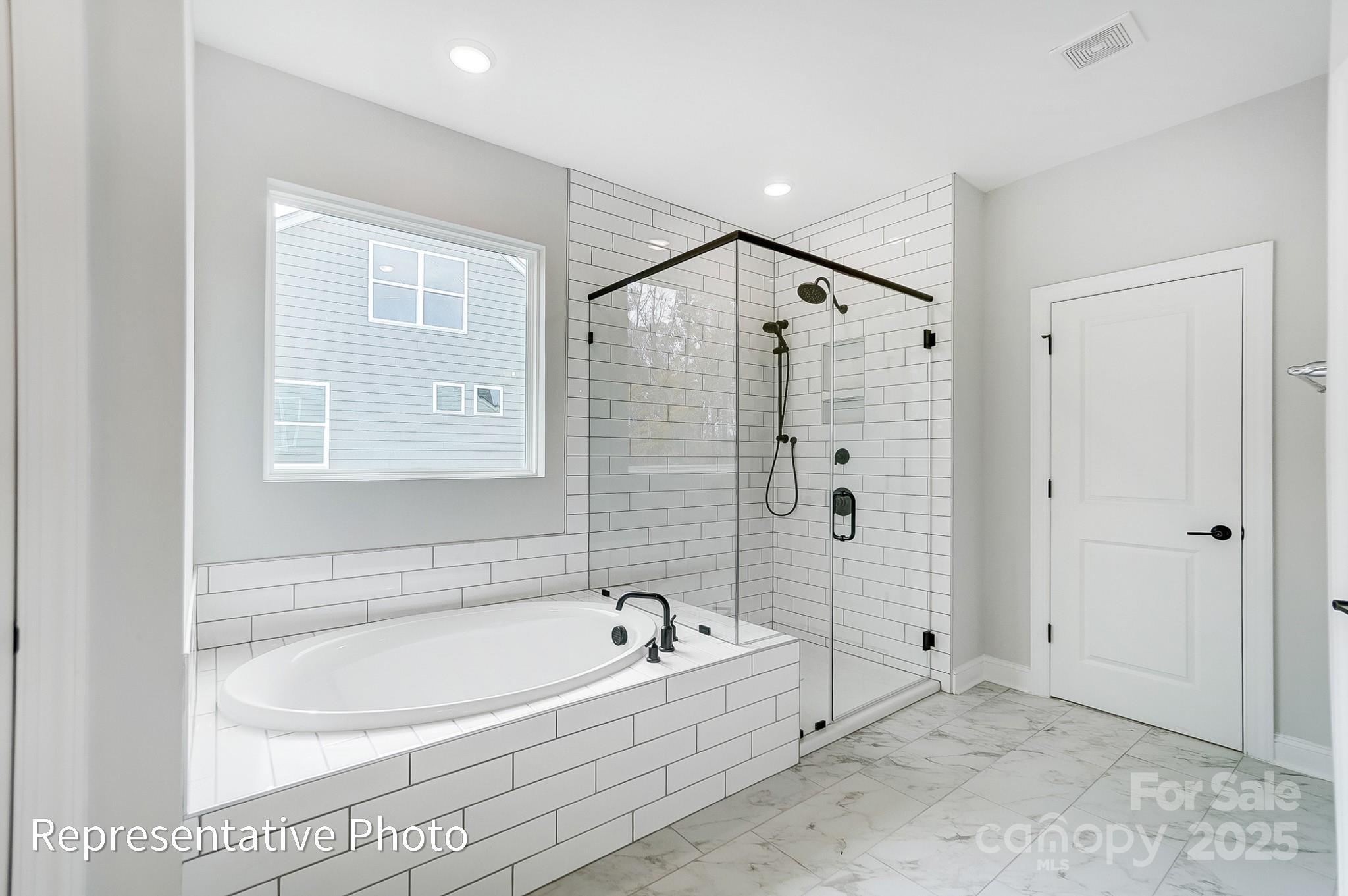 2241 Tabor Road Sherrills Ford, NC 28673 - Photo 23 of 38 a bathroom with a bathtub and a shower