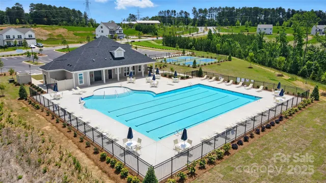 an aerial view of a house with a garden